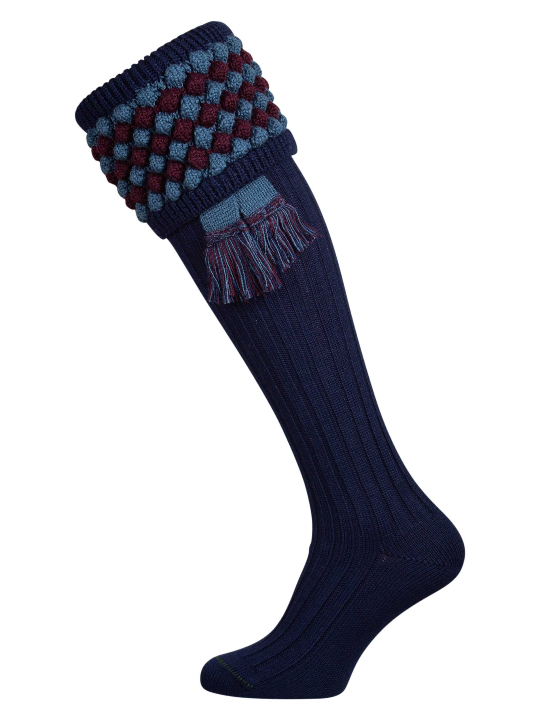 Navy blue knitted shooting socks with Ancient Blue and Mulberry pattern in the turnover top