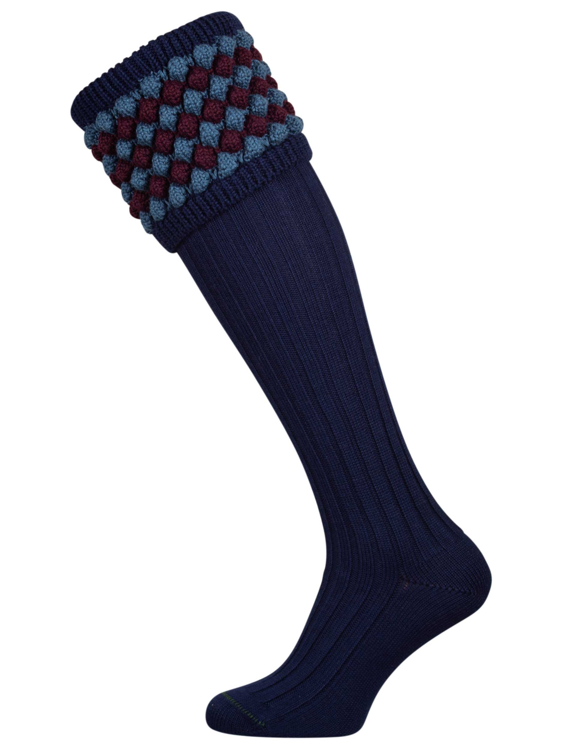 Navy blue knitted shooting socks with Ancient Blue and Mulberry pattern in the turnover top