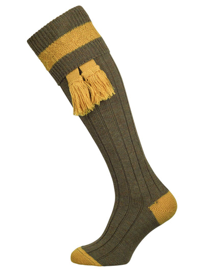 Green long knitted shooting socks with pollen gold pattern in the turnover top