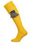 Long knitted shooting socks with a cable turnover in a bright canary yellow.