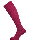 Long knitted shooting socks with a cable turnover in a deep pink purple.