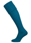 Long knitted shooting socks with a cable turnover in a rich teal petrol blue.