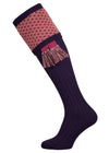 Long knitted shooting socks with a ribbed leg. Dark purple with a deep pink and camel pattern in the turnover top.