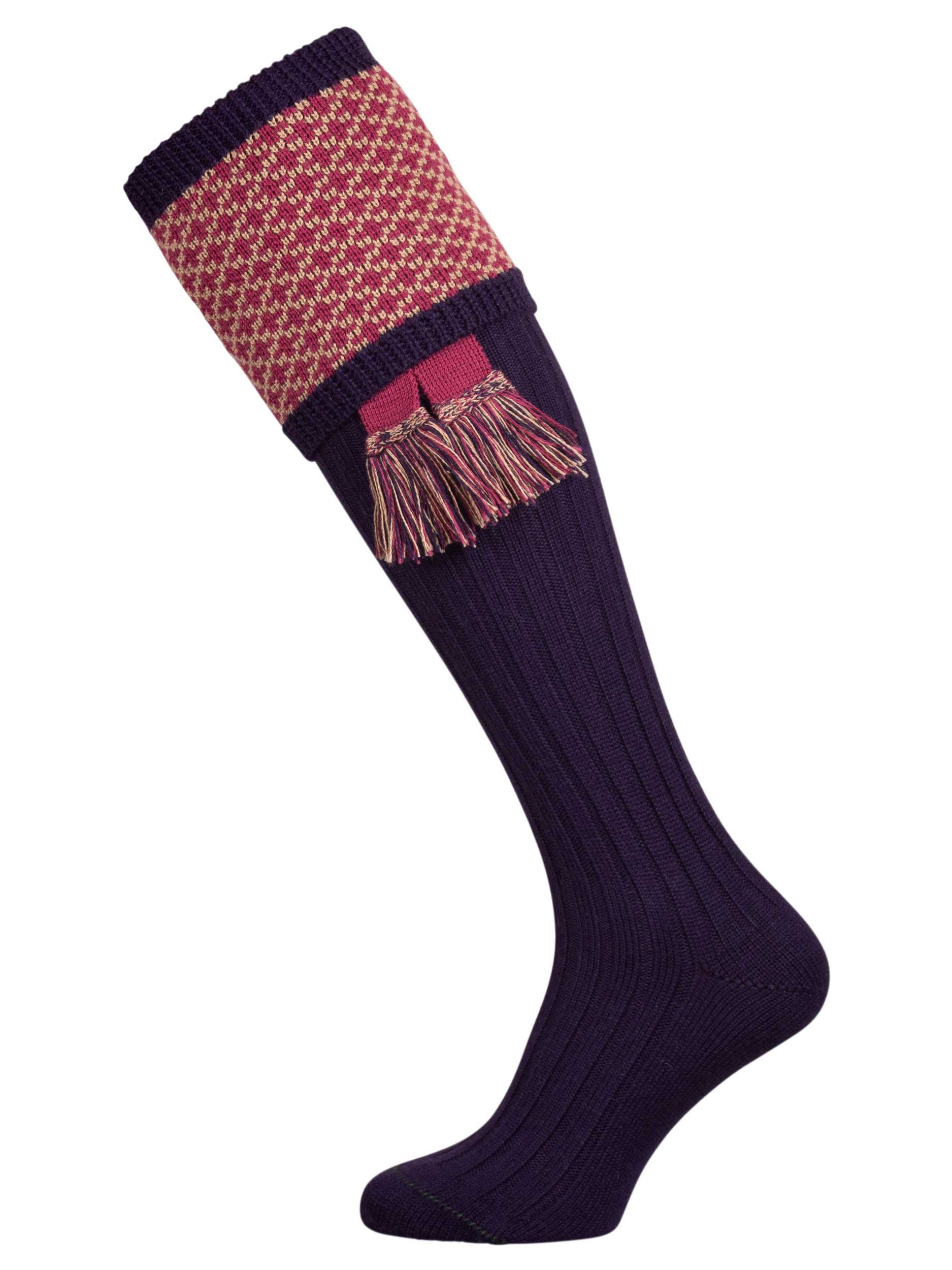 Long knitted shooting socks with a ribbed leg. Dark purple with a deep pink and camel pattern in the turnover top.