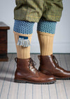 Long knitted shooting socks with a ribbed leg. Beige with a navy and sky blue pattern in the turnover top.