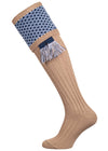 Long knitted shooting socks with a ribbed leg. Beige with a navy and sky blue pattern in the turnover top.
