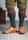 Long dark grey knitted shooting socks with a ribbed leg, features 8 different colours in the pattern turnover top.