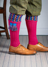 Long knitted shooting socks in bright pink with a ribbed leg, features 8 different colours in the pattern turnover top.