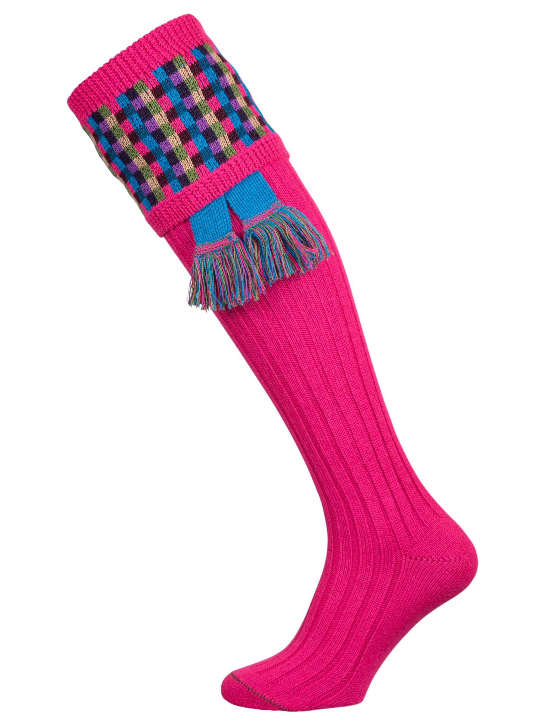 Long knitted shooting socks in bright pink with a ribbed leg, features 8 different colours in the pattern turnover top.