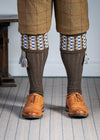 Long knitted shooting socks in earthy brown with a ribbed leg, features 8 different colours in the pattern turnover top.