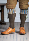Long knitted shooting socks in earthy brown with a ribbed leg, features 8 different colours in the pattern turnover top.