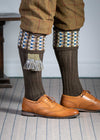 Long knitted shooting socks in earthy brown with a ribbed leg, features 8 different colours in the pattern turnover top.