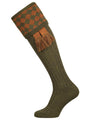 Traditional knitted shooting socks with a chessboard pattern in the turnover, in green and gold.