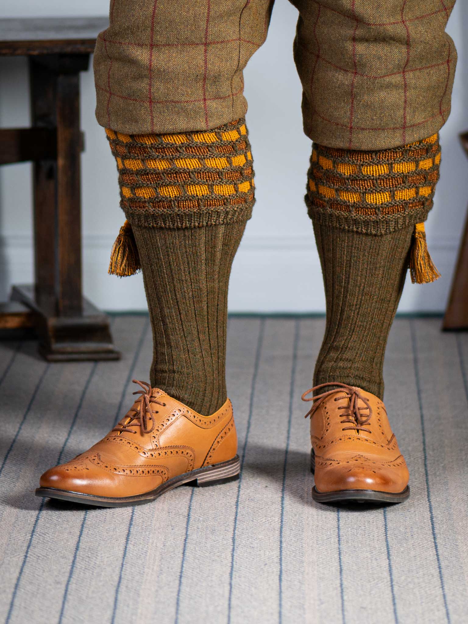 Green shooting socks with gold and bronze pattern.