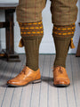 Green shooting socks with gold and bronze pattern.