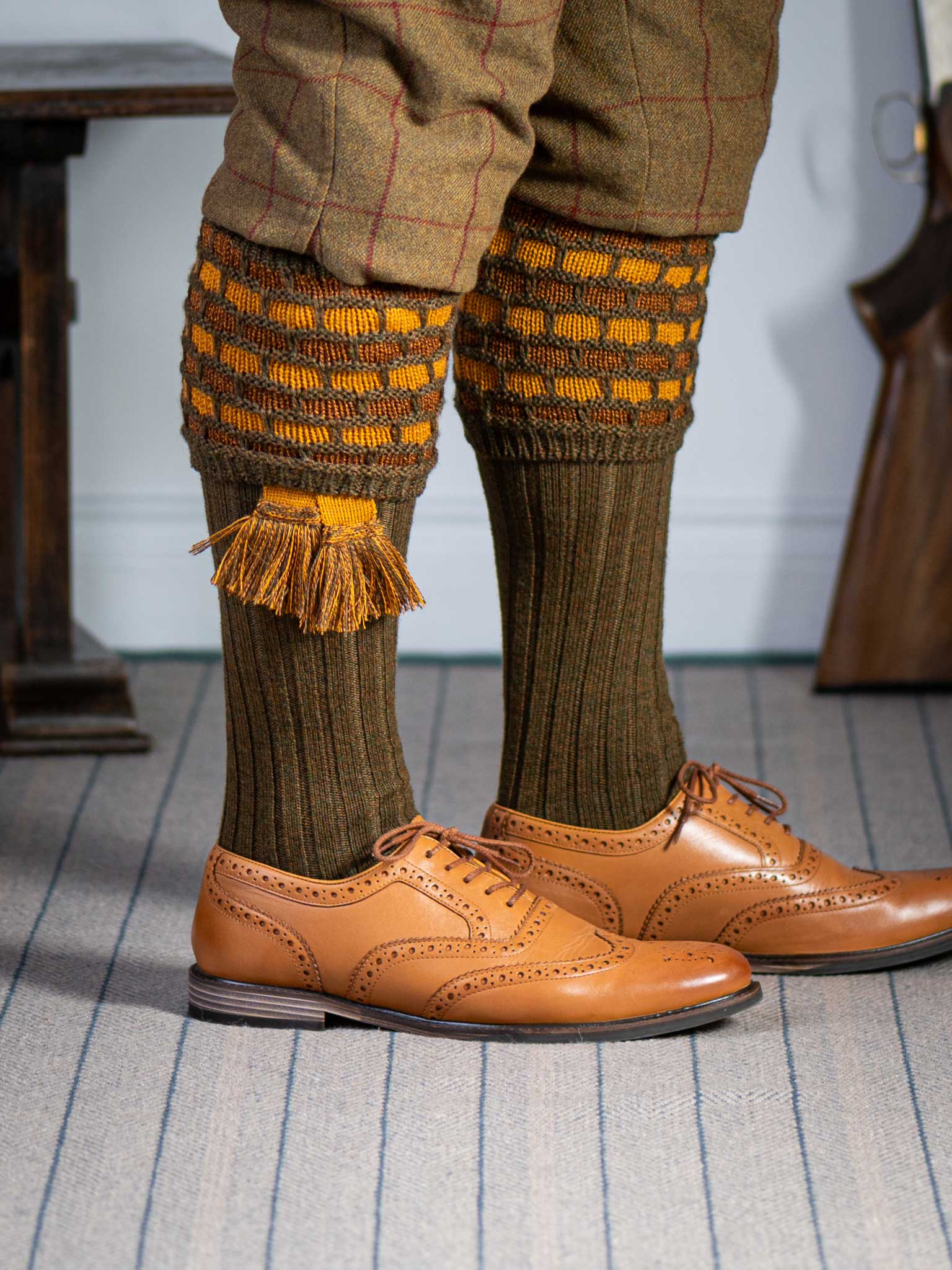 Green shooting socks with gold and bronze pattern.