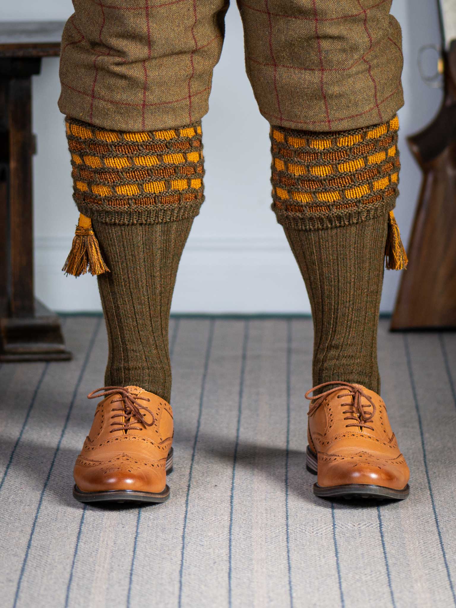 Green shooting socks with gold and bronze pattern.