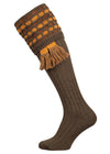 Traditional knitted shooting socks with a textured knitted top in green with gold and brown pattern.