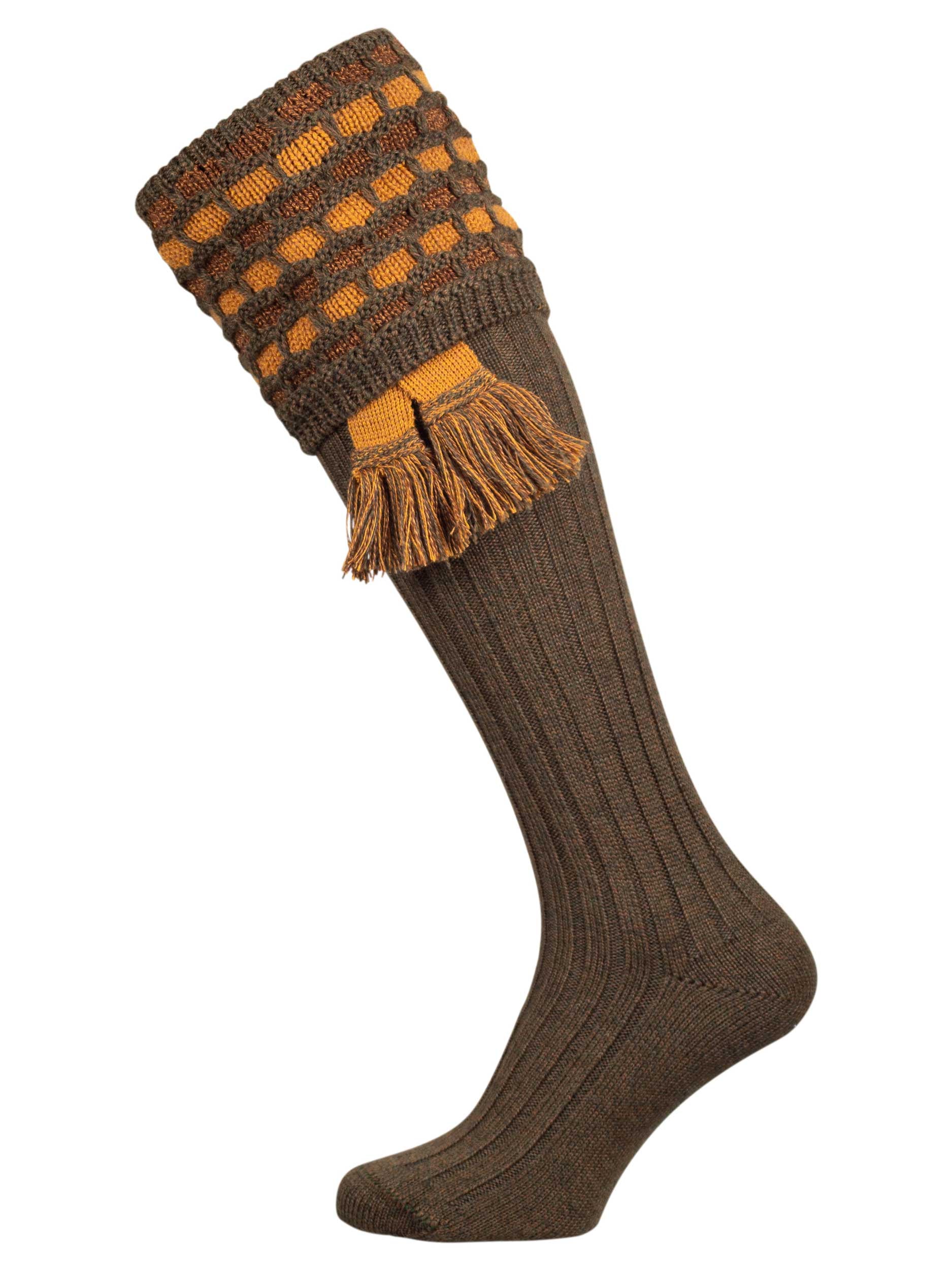 Traditional knitted shooting socks with a textured knitted top in green with gold and brown pattern.