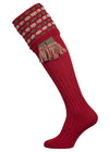 Traditional knitted shooting socks with a textured knitted top in brick red with green and beige pattern.