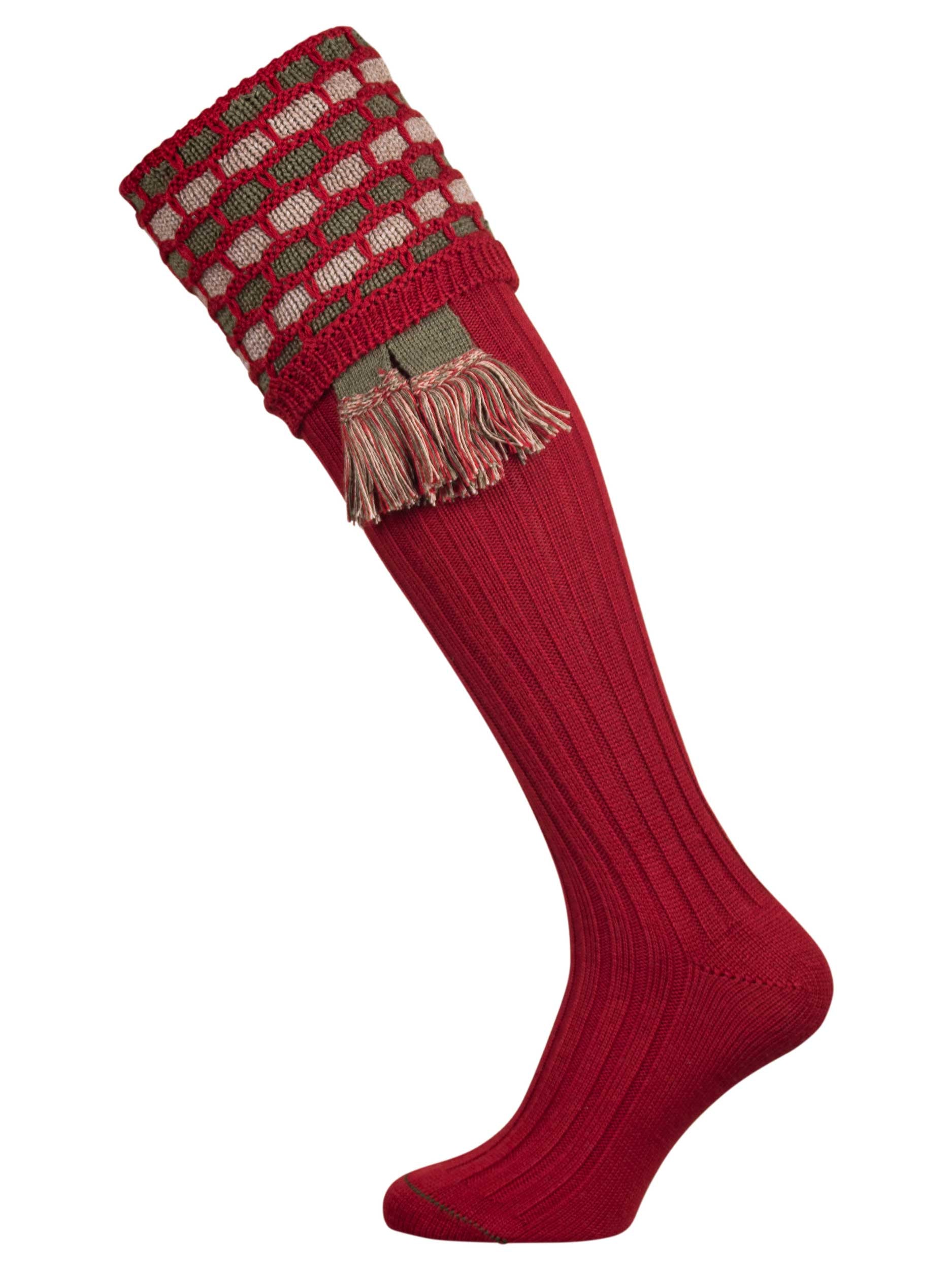 Traditional knitted shooting socks with a textured knitted top in brick red with green and beige pattern.