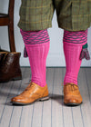 Traditional knitted shooting socks with ribbed leg in pink with a green scallop stitch detail in the turnover top