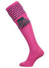 Traditional knitted shooting socks with ribbed leg in pink with a green scallop stitch detail in the turnover top