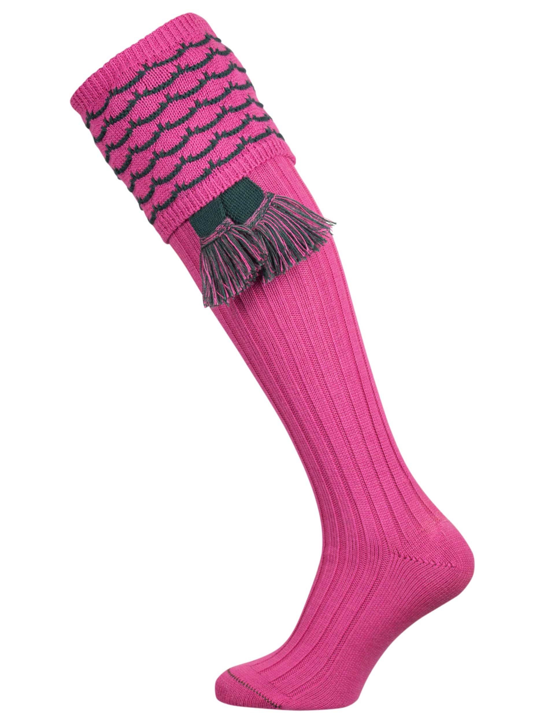 Traditional knitted shooting socks with ribbed leg in pink with a green scallop stitch detail in the turnover top