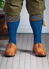 Traditional knitted shooting socks with ribbed leg in deep blue with a gold scallop stitch detail in the turnover top