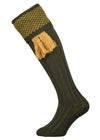 Wool shooting sock in green with a gold knitted pattern in the cuff