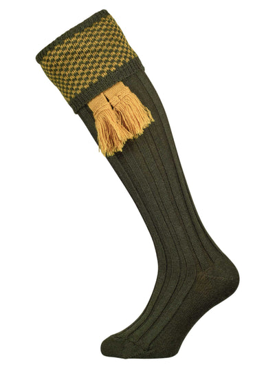 Wool shooting sock in green with a gold knitted pattern in the cuff