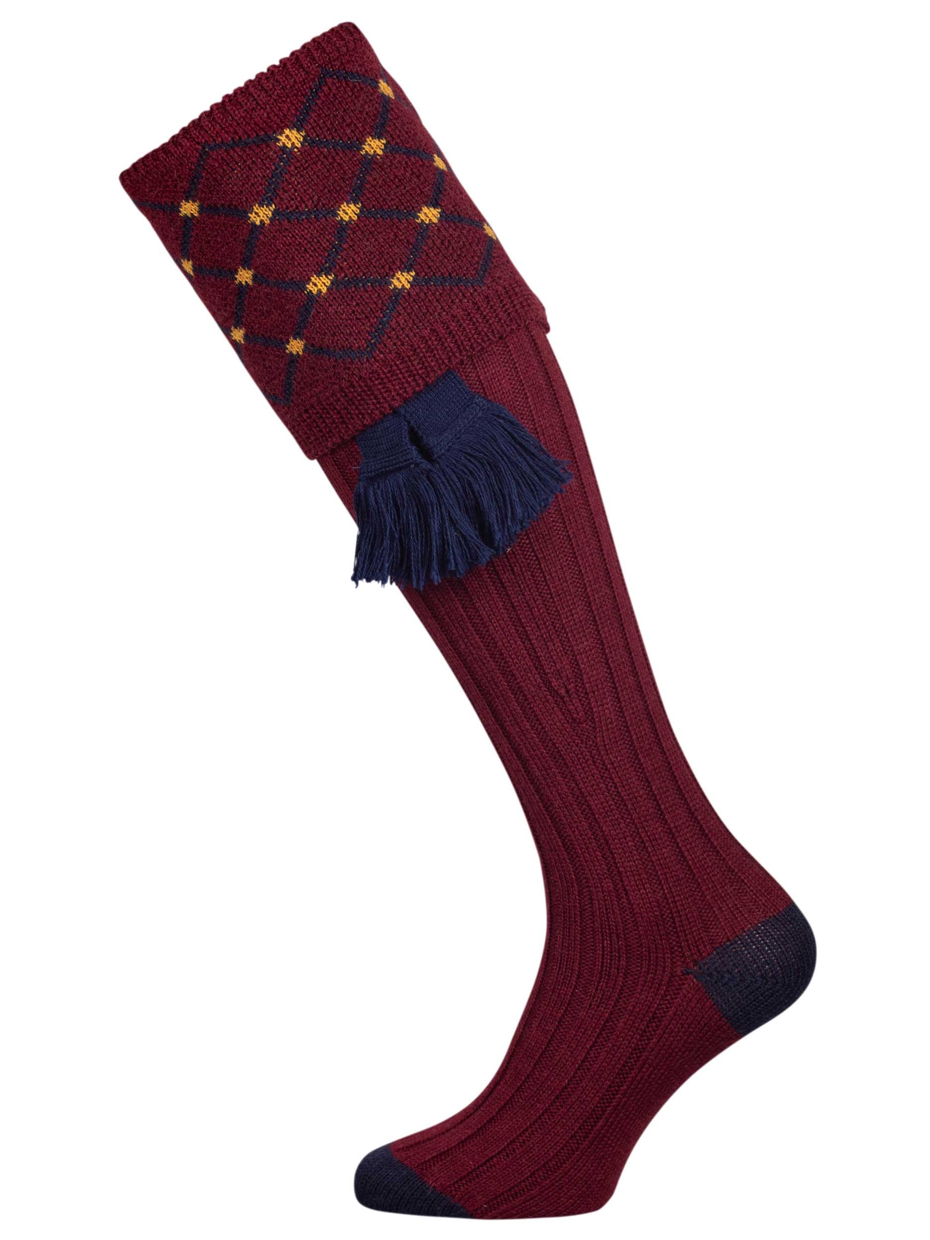Merino wool shooting sock in deep burgundy with a gold and navy pattern knitted in the turnover