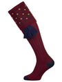 Merino wool shooting sock in deep burgundy with a gold and navy pattern knitted in the turnover
