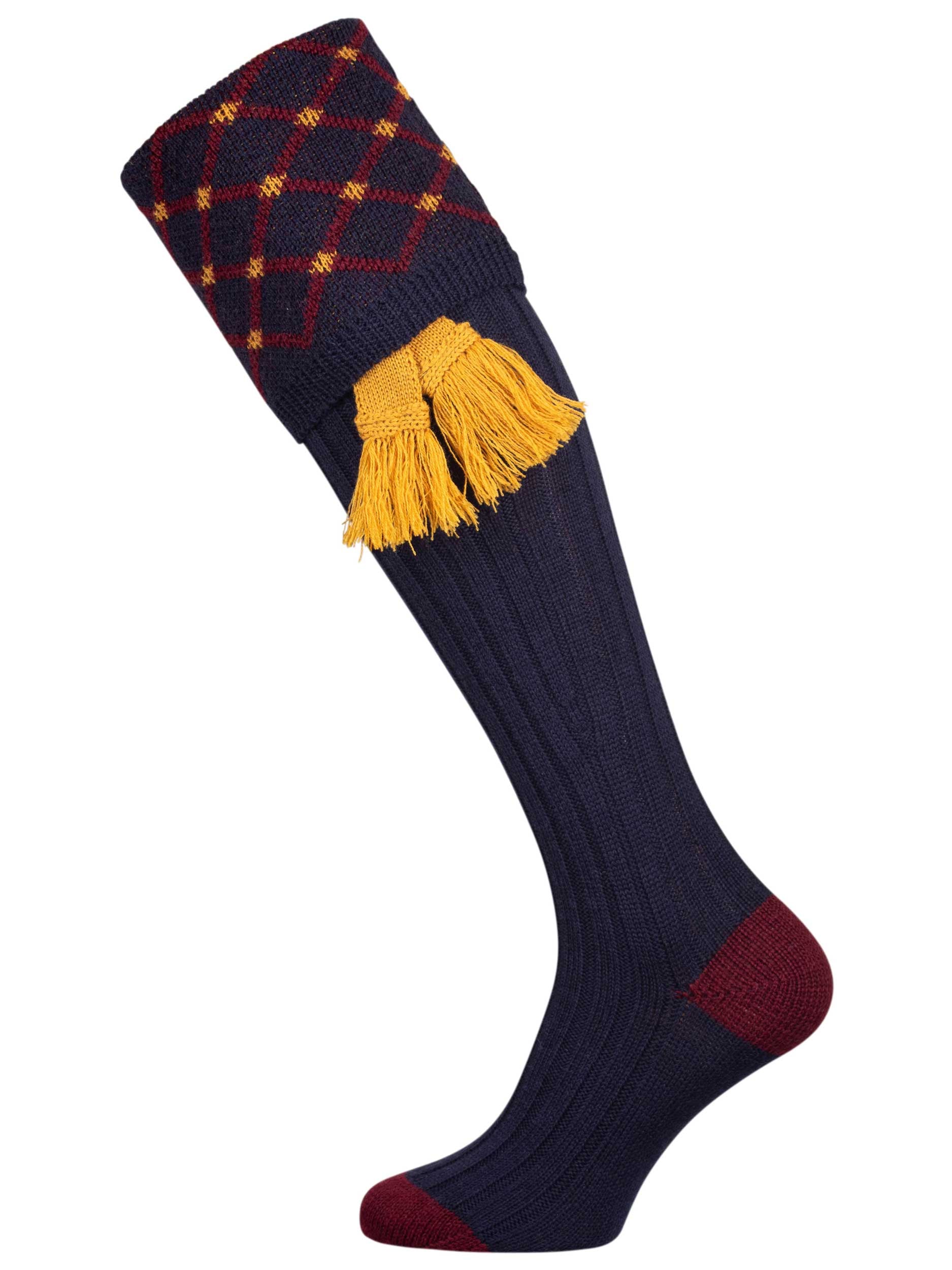 Merino wool shooting sock in navy blue with a gold and burgundy pattern knitted in the turnover