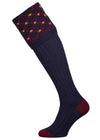Merino wool shooting sock in navy blue with a gold and burgundy pattern knitted in the turnover