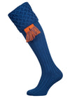 Traditional knitted shooting socks with ribbed leg in mid blue with a lattice knit pattern in the turnover