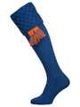 Traditional knitted shooting socks with ribbed leg in mid blue with a lattice knit pattern in the turnover