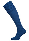Traditional knitted shooting socks with ribbed leg in mid blue with a lattice knit pattern in the turnover