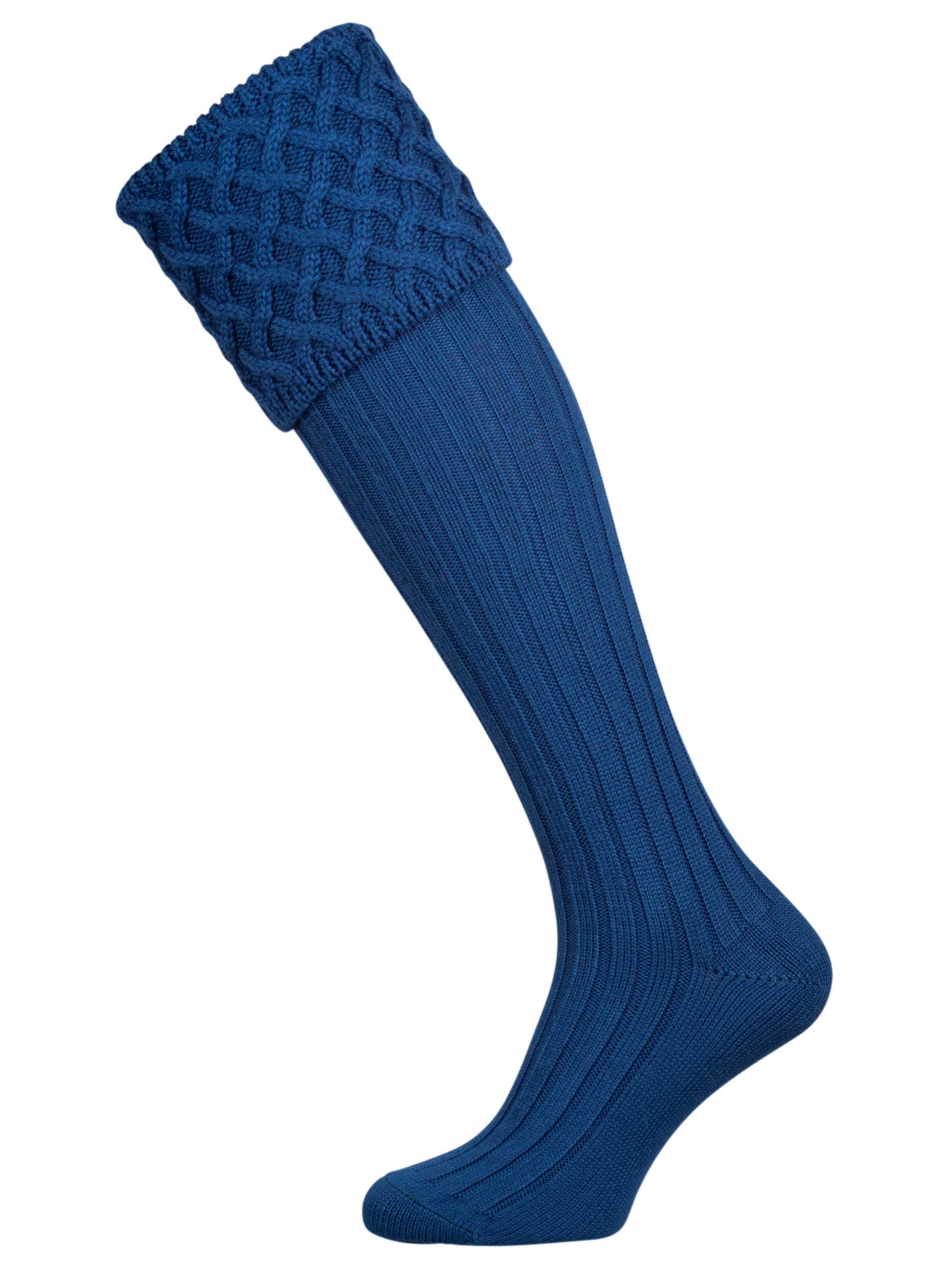 Traditional knitted shooting socks with ribbed leg in mid blue with a lattice knit pattern in the turnover