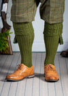 Knitted shooting socks with cable pattern though the leg and the turnover in khaki green