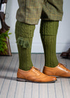 Knitted shooting socks with cable pattern though the leg and the turnover in khaki green