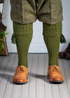 Knitted shooting socks with cable pattern though the leg and the turnover in khaki green