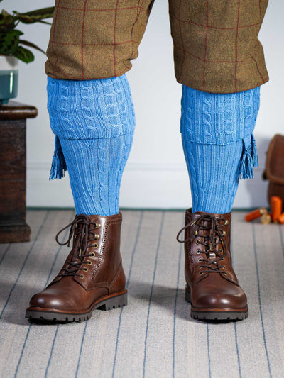 Knitted shooting socks with cable pattern though the leg and the turnover in sky blue