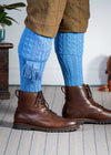 Knitted shooting socks with cable pattern though the leg and the turnover in sky blue