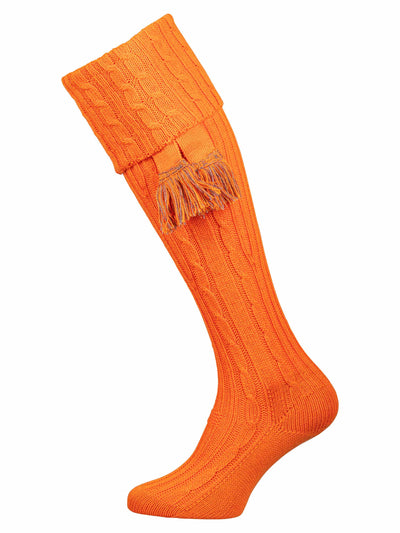 Bright orange knee high socks with cable detail in the leg. Optional co-ordinating garter.