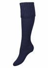 Women's navy blue knitted shooting sock with cable knit pattern in the turnover.