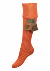 Orange knee high knitted shooting sock for women with optional green garter