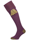Merino wool shooting sock in mid purple with a green and salmon pattern knitted in the turnover
