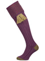 Merino wool shooting sock in mid purple with a green and salmon pattern knitted in the turnover