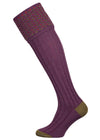 Merino wool shooting sock in mid purple with a green and salmon pattern knitted in the turnover